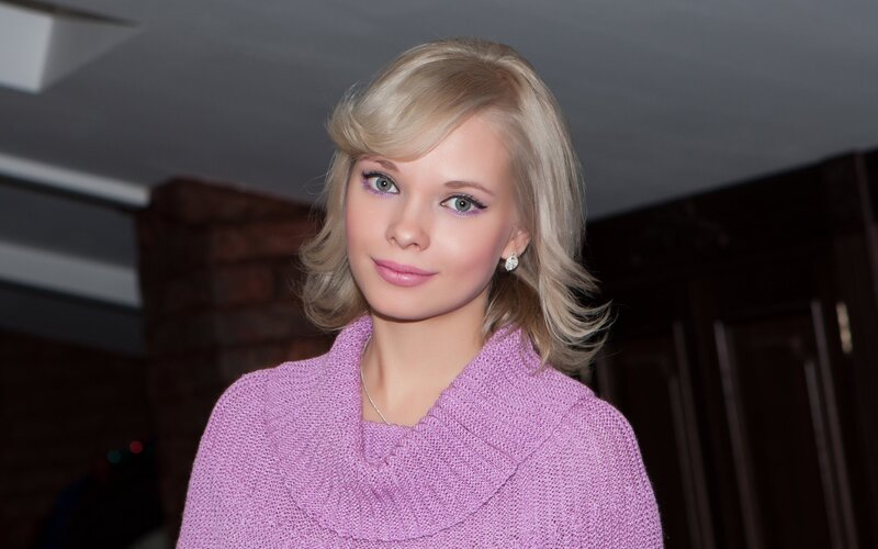 woman in pink sweater