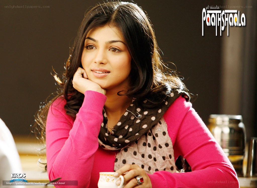 woman in pink sweater holding cup