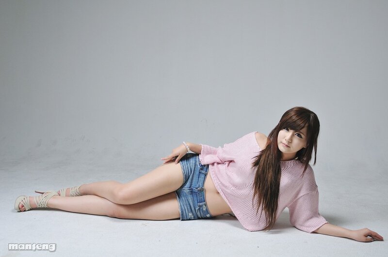 woman in pink sweater lying down