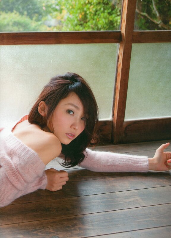 woman in pink sweater on floor