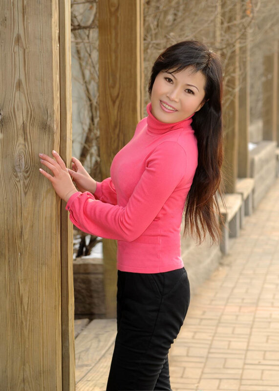 woman in pink sweater smiling