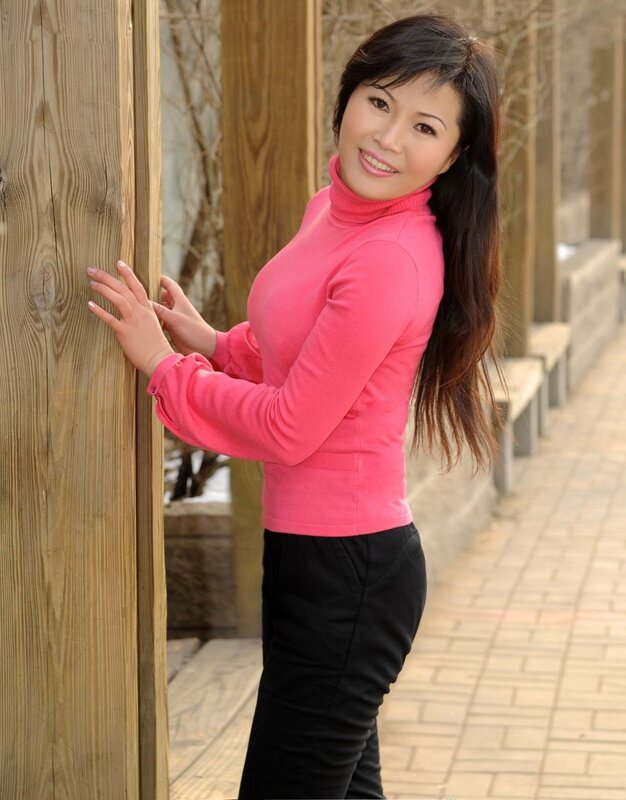 woman in pink sweater smiling