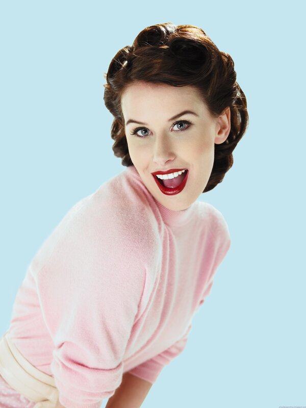 woman in pink sweater smiling