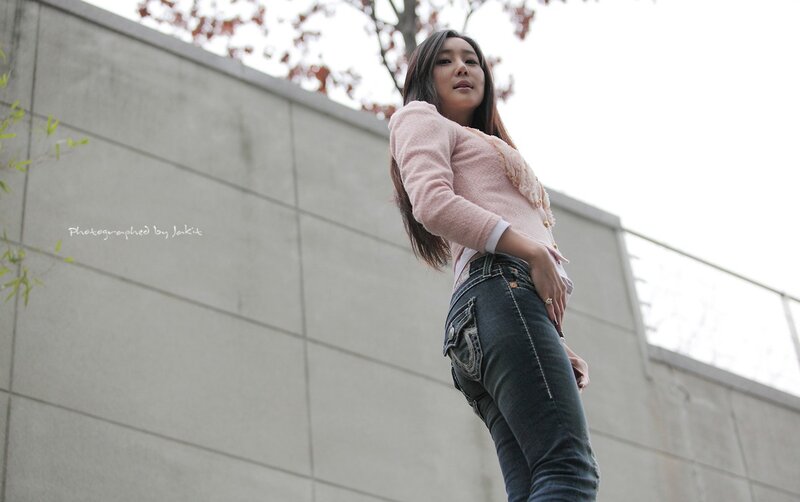 woman in pink sweater standing