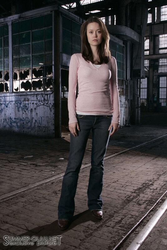 woman in pink sweater standing