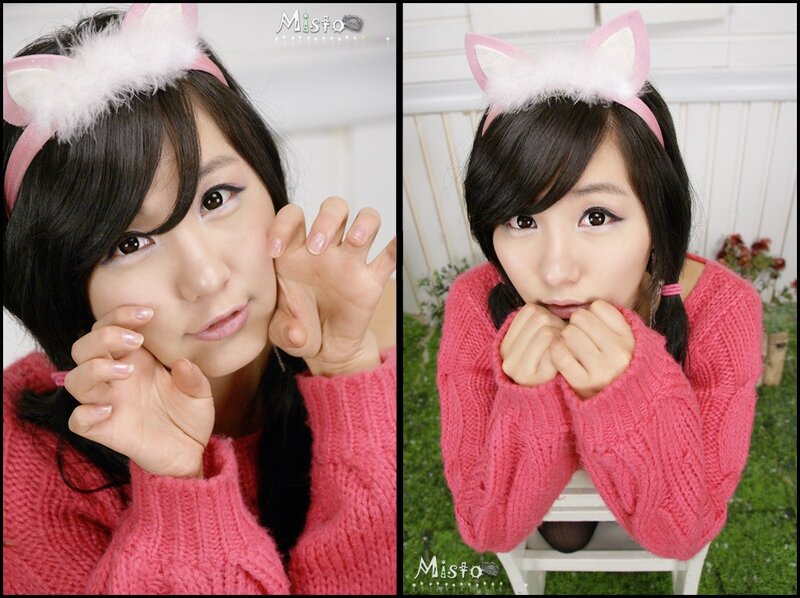 woman in pink sweater with cat ears