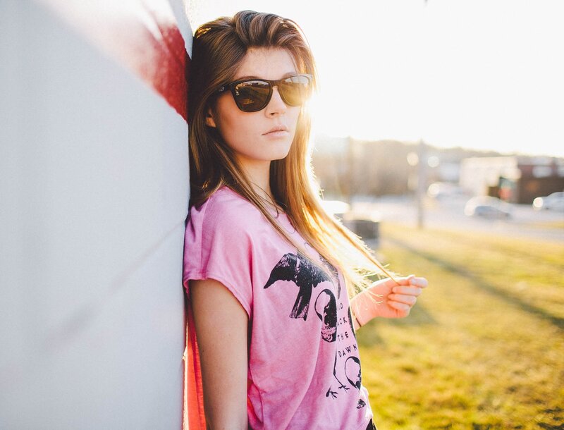 woman in pink t-shirt and sunglasses