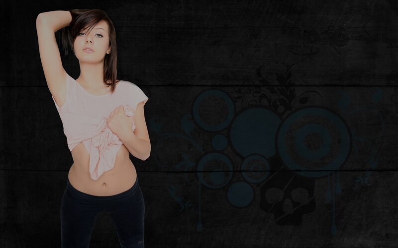 woman in pink top against dark background