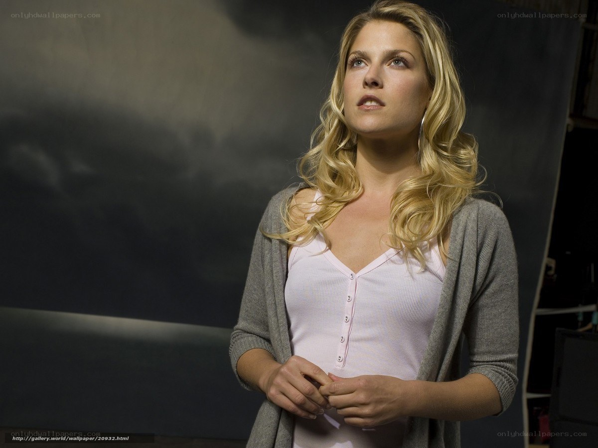 woman in pink top and grey cardigan