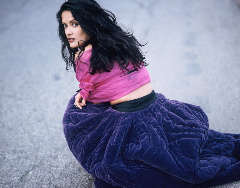 woman in pink top and purple skirt