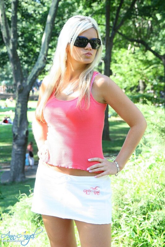 Woman in pink top and white skirt