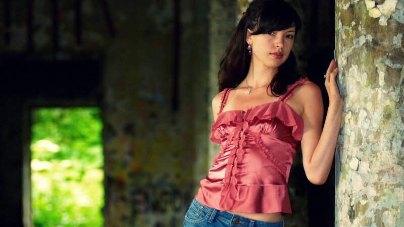 Woman in Pink Top — Dramatic, Afternoon, Photograph, Jeans
