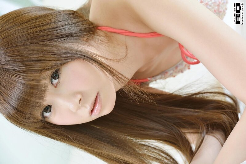 woman in pink top looking up