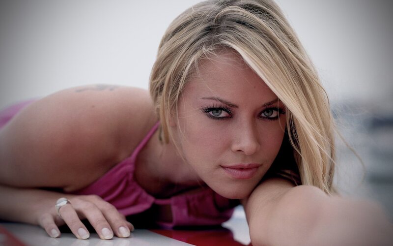 woman in pink top lying down