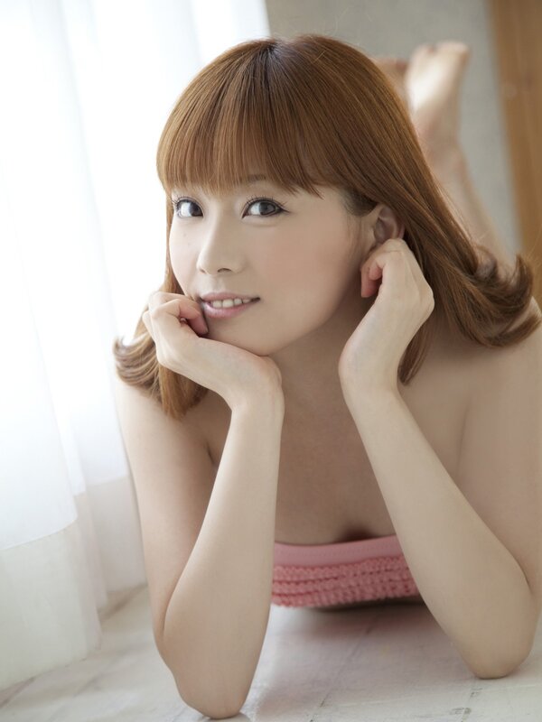 woman in pink top lying down