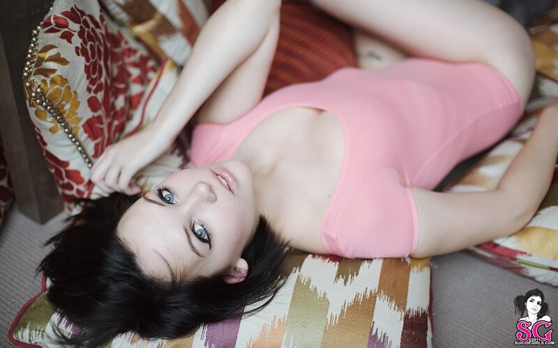 woman in pink top lying down
