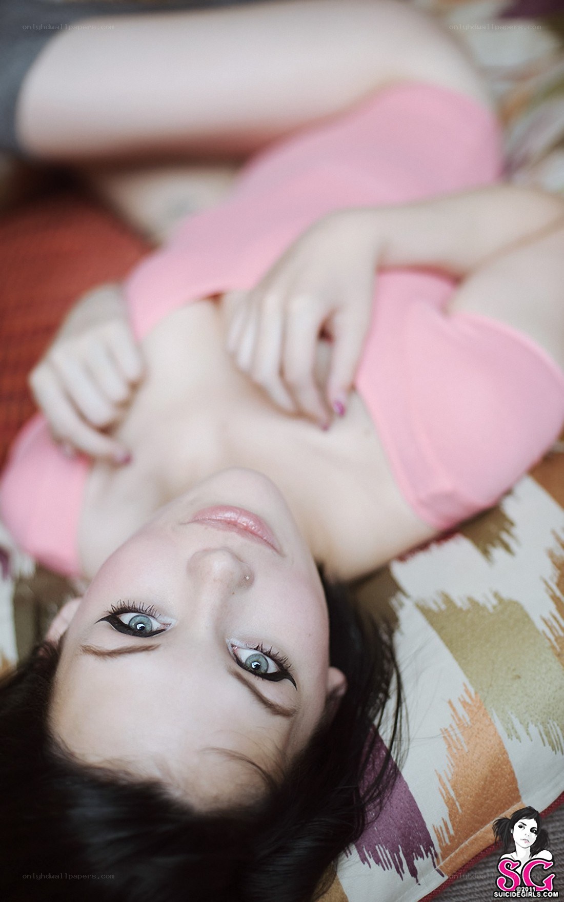woman in pink top lying down