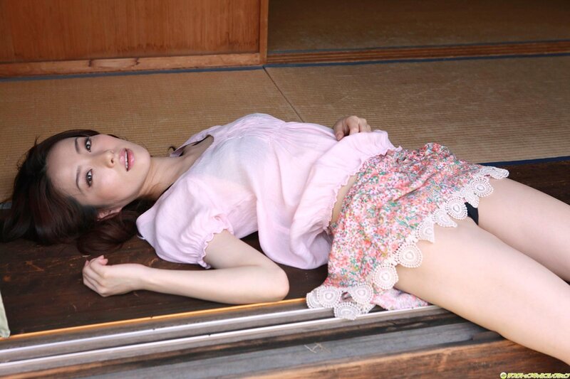 woman in pink top lying on floor