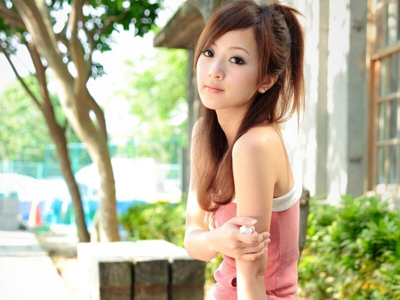 woman in pink top outdoors