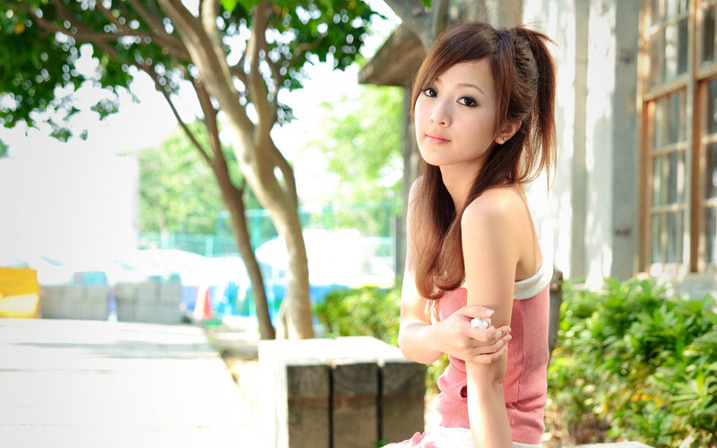 woman in pink top outdoors