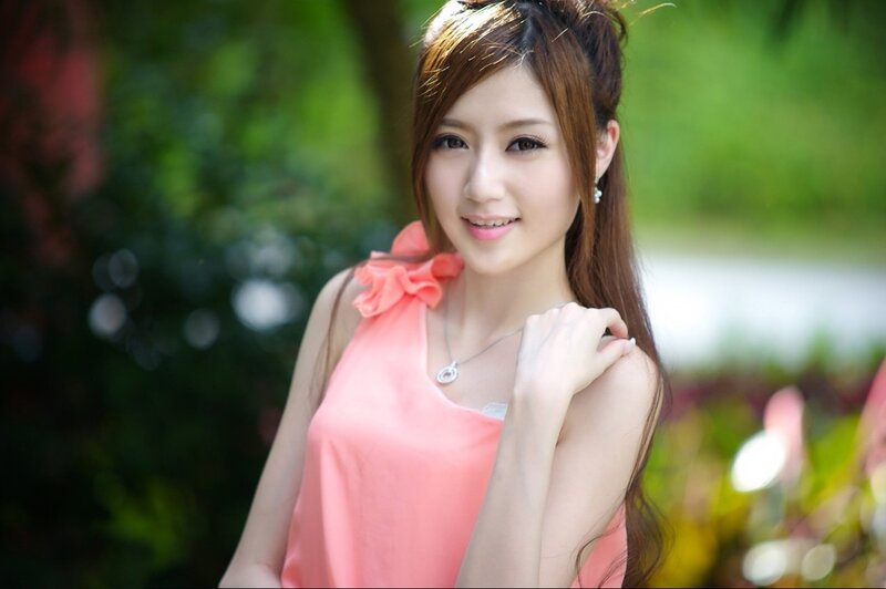 woman in pink top outdoors