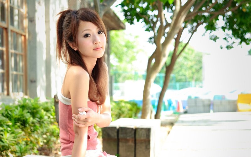 woman in pink top outdoors