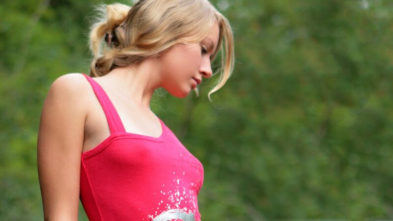 woman in pink top outdoors