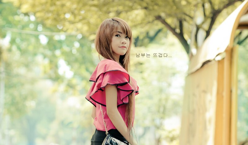 woman in pink top outdoors