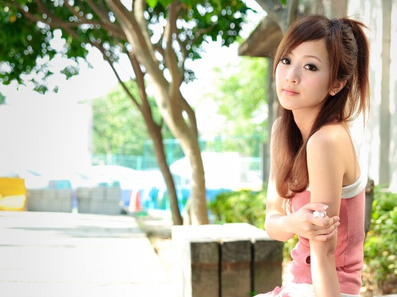 woman in pink top outdoors