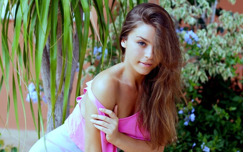 woman in pink top outdoors