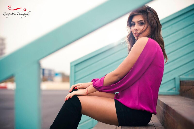 woman in pink top sitting