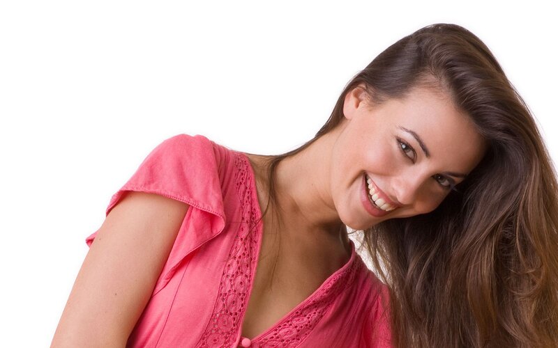 woman in pink top smiling