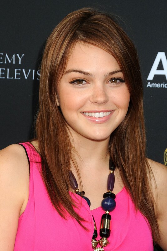 woman in pink top smiling
