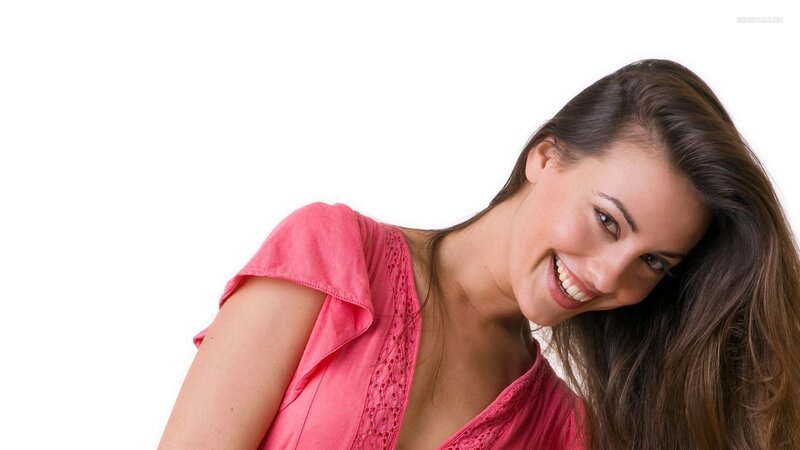 woman in pink top smiling