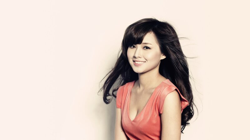 woman in pink top smiling