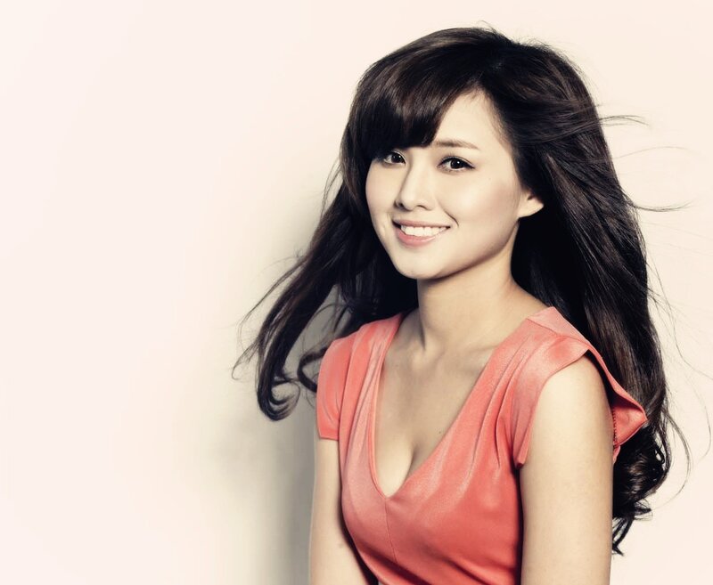 woman in pink top smiling