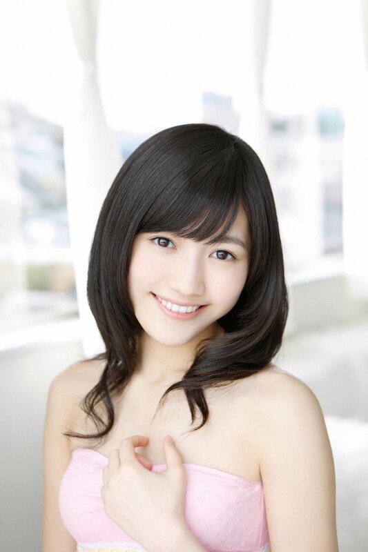 woman in pink top smiling