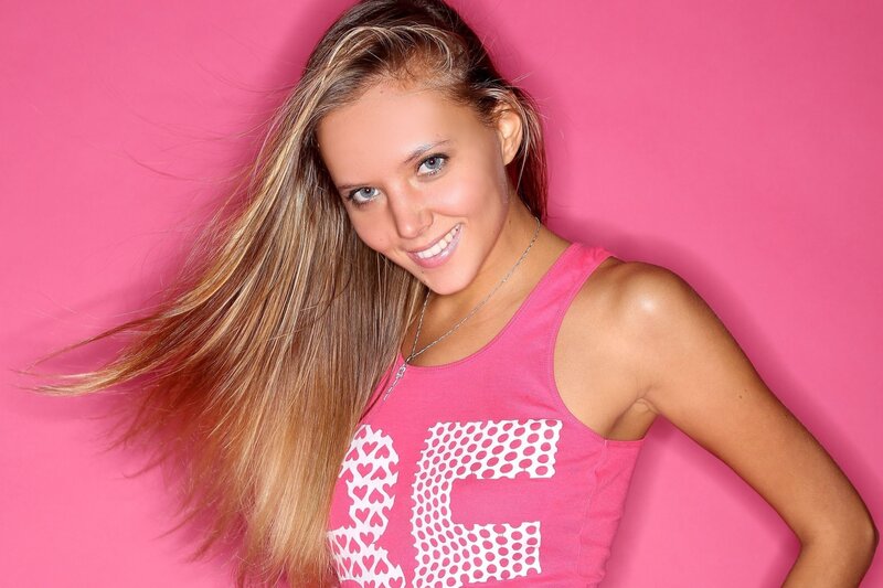 woman in pink top smiling