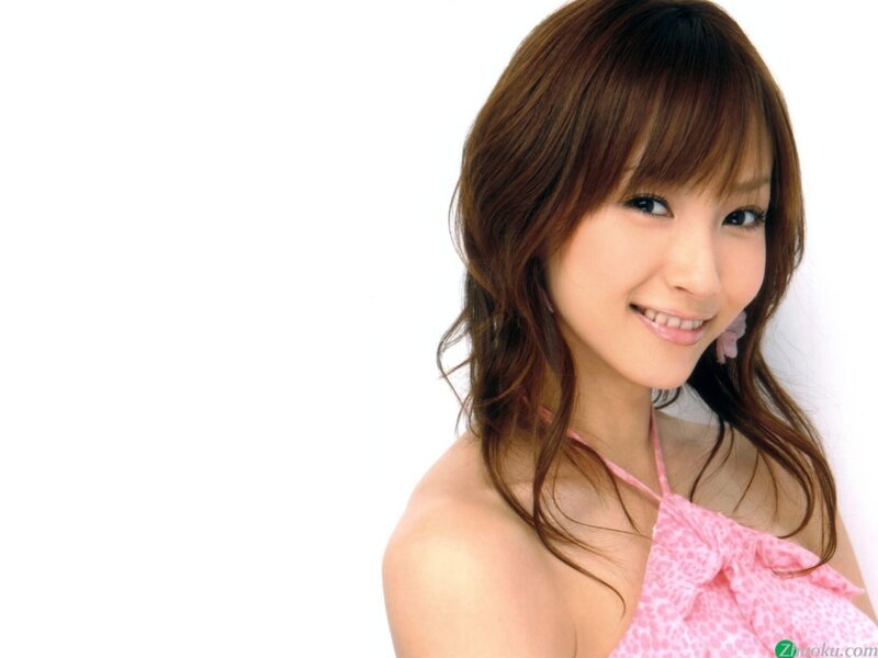 woman in pink top smiling