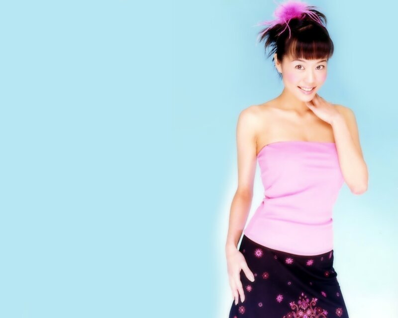 woman in pink top smiling