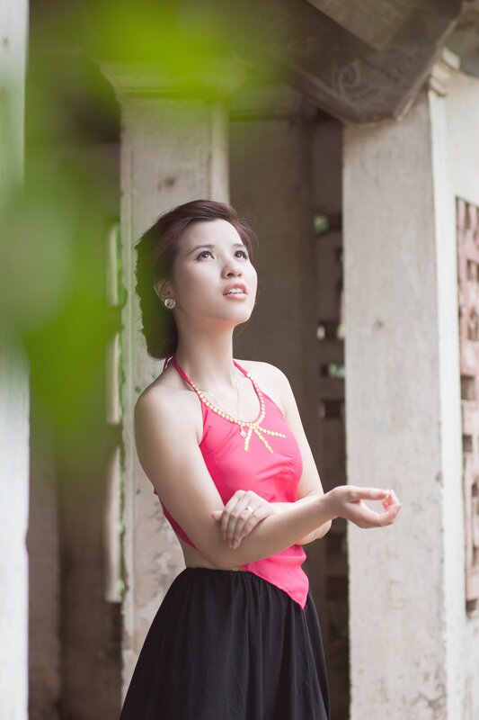 woman in pink top standing outside