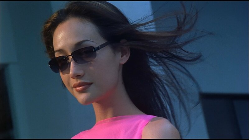 woman in pink top with sunglasses