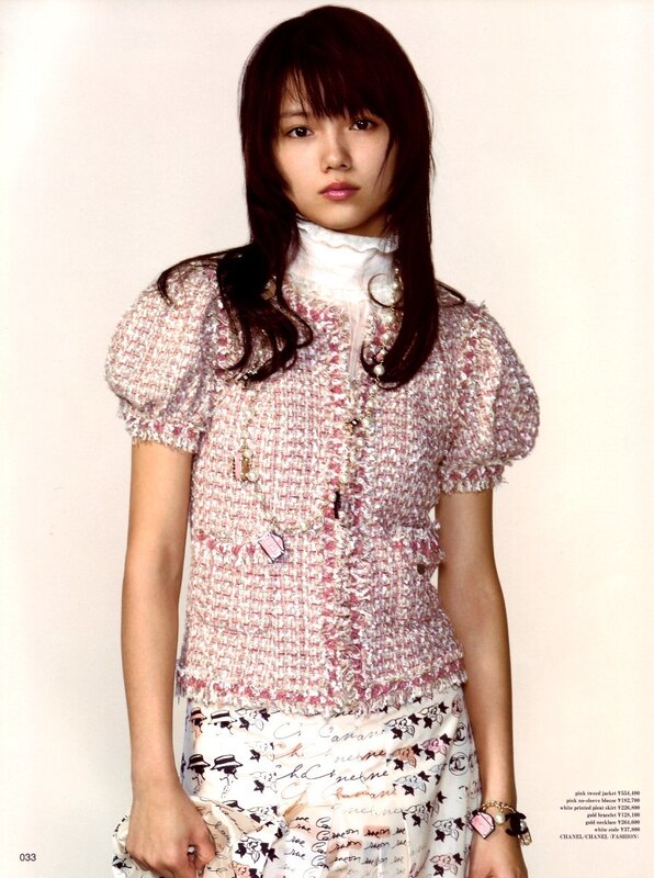 woman in pink tweed jacket