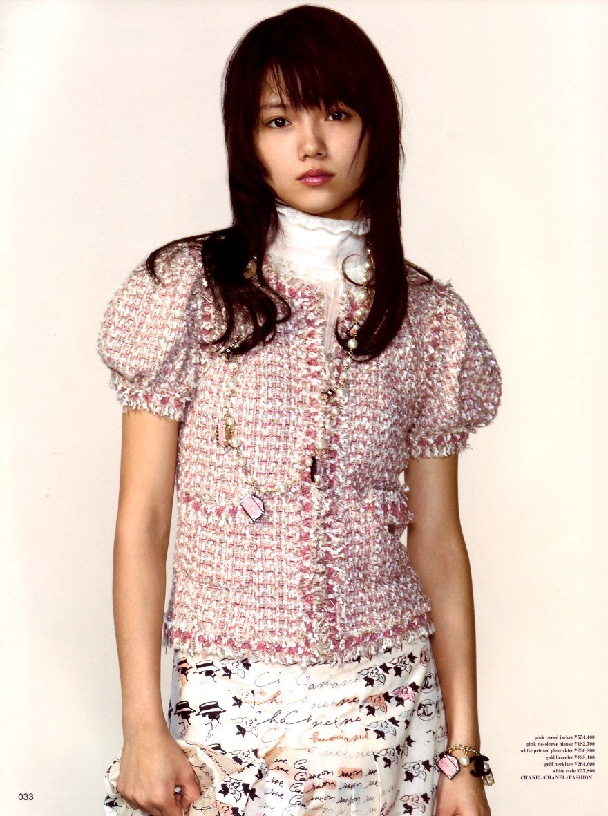 woman in pink tweed jacket