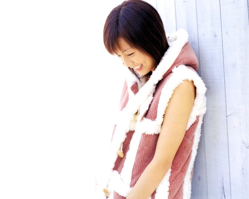 woman in pink vest smiling