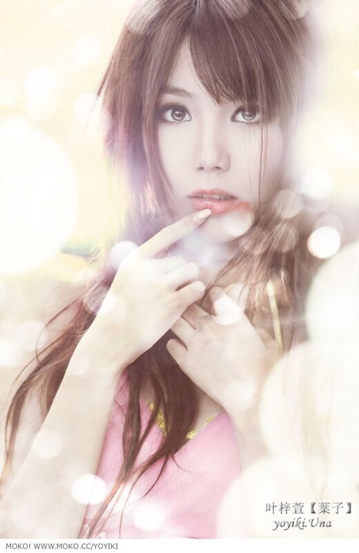 woman in pink with finger on lips