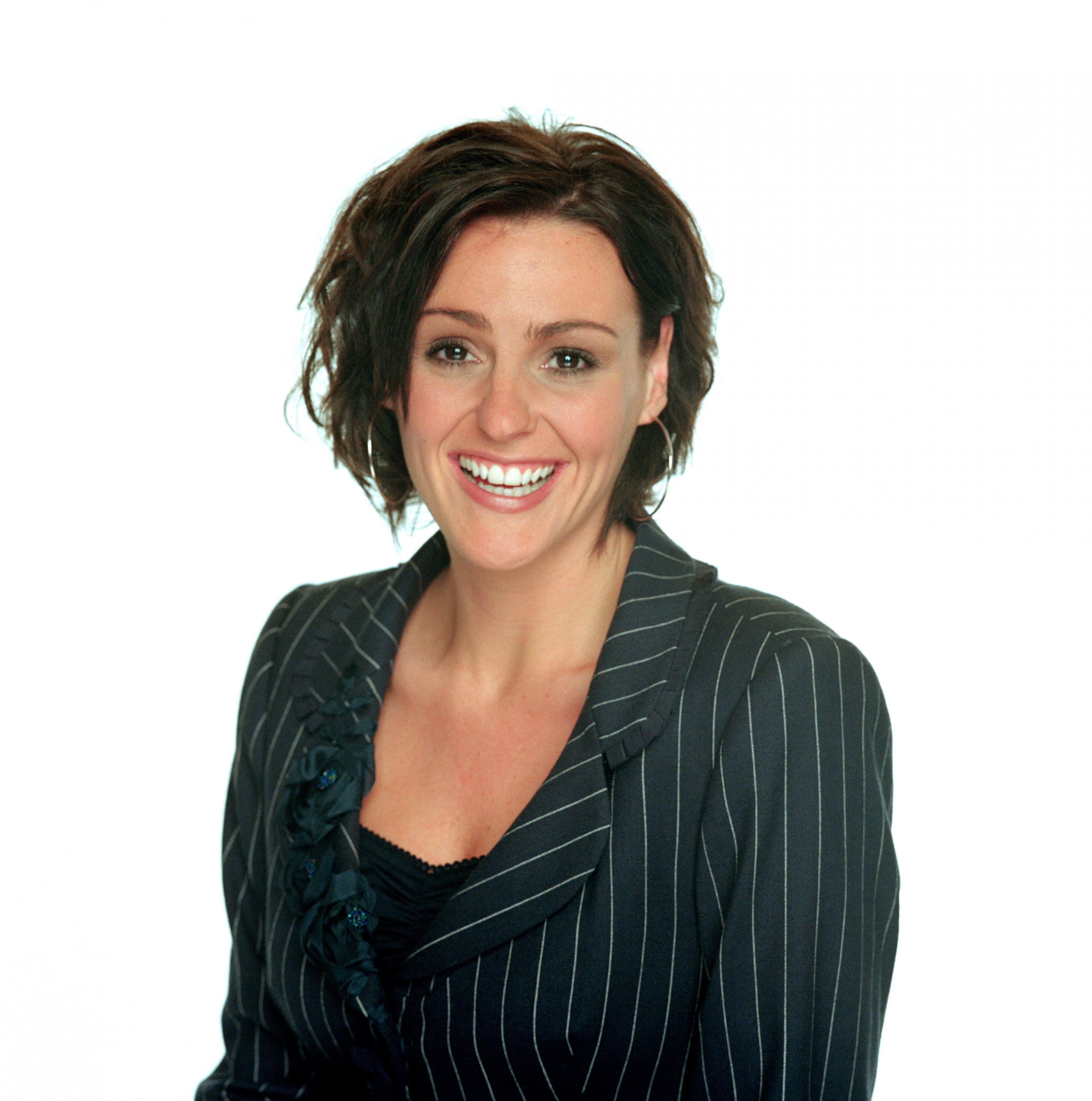 woman in pinstripe jacket smiling