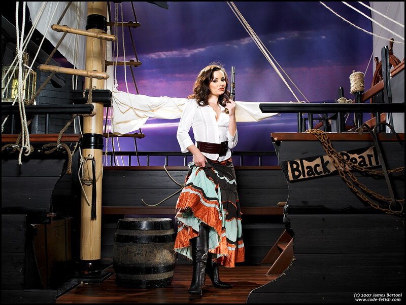 Woman in pirate costume on ship