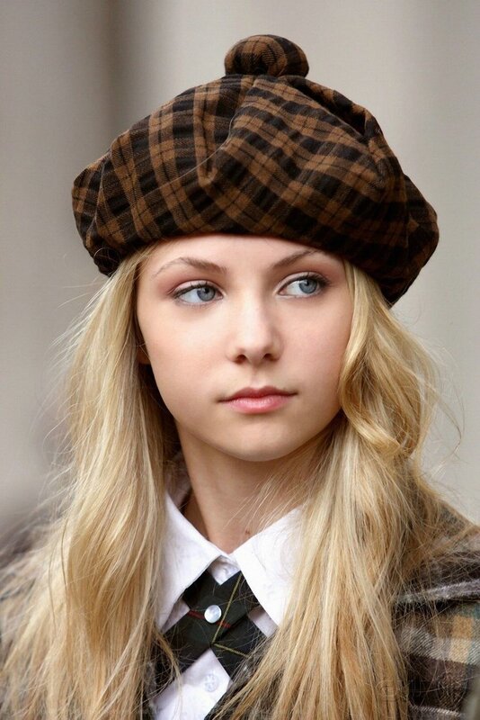 woman in plaid beret