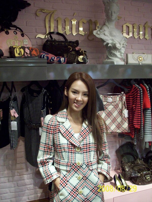 woman in plaid coat at store